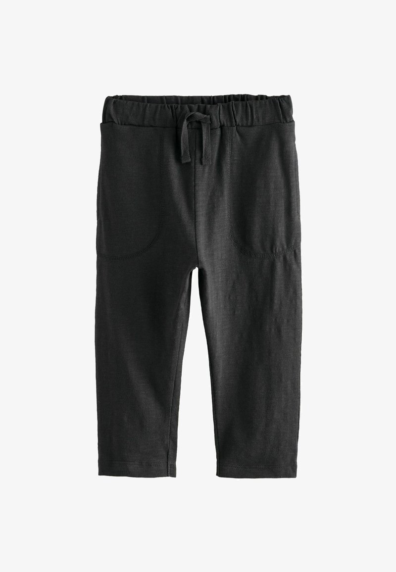 Zwarte leggings van zacht materiaal, met een elastische tailleband en een trekkoord, voorzien van twee voorzakken en nette stiksels.