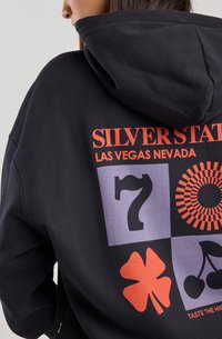 Black hoodie featuring "SILVERSTATE LAS VEGAS NEVADA" text. Front design includes numbers, shapes, and a cherry graphic in various colors.