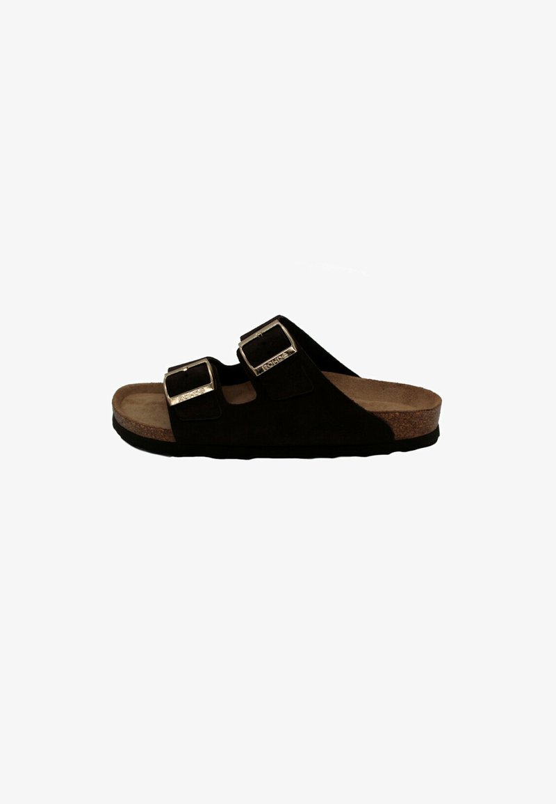 Black suede slide sandal with two adjustable silver buckles, cork footbed, and a textured rubber sole for grip.