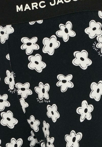 Tessuto nero con motivo floreale bianco, misto cotone, con il logo "Marc Jacobs" in bianco sulla fascia della vita.