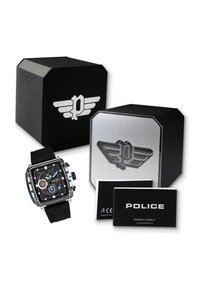 Quadratische Uhr mit schwarzem Silikonarmband, durchsichtigem Gehäuse und mehrfarbigem Ziffernblatt mit Subdials. Zwei Uhrenboxen in Schwarz und Silber. Inklusive Garantie.