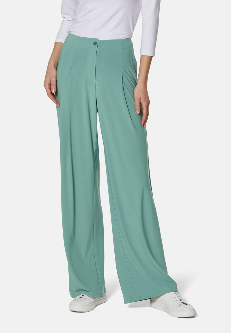 Wide-leg trousers in light teal, featuring a smooth texture, pleated front design, and a single button closure at the waistband.