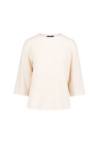 Haut en tricot à côtes de couleur crème avec des manches trois-quarts et un col rond, présenté sur un fond blanc.