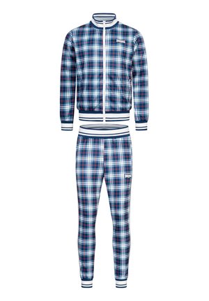 Traje de chándal de cuadros que incluye una chaqueta con cremallera y pantalones cónicos, en colores marino, blanco y rojo. El material tiene un acabado suave; puños y ribetes acanalados.