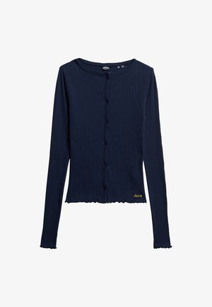 Cardigan long à manches longues en maille côtelée marine avec un encolure arrondie, une fermeture à boutons sur le devant, un ourlet ondulé, et une broderie jaune sur le côté inférieur gauche.