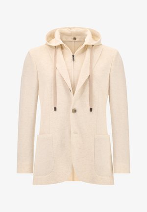 Krémový blazer s kapucňou, vyrobený z textúrovaného materiálu. Má predný zips, dve veľké vrecká a uzatváranie na jeden gombík.