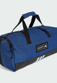 Duffle bag in blue heathered fabric with a black base. Features dual black handles and a zipper, with a white logo and label detail.