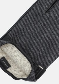 Szare rękawiczki z mieszanki wełny z rypsowym wzorem, z czarną skórzaną lamówką i miękkim beżowym podszewką. Widoczna metka marki wewnątrz.