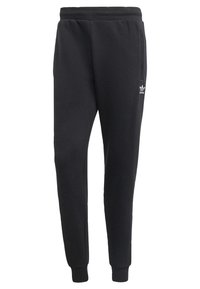 Black sweatpants made of soft cotton blend fabric. Elastic waistband, tapered fit, two side pockets, and white logo on the left leg.