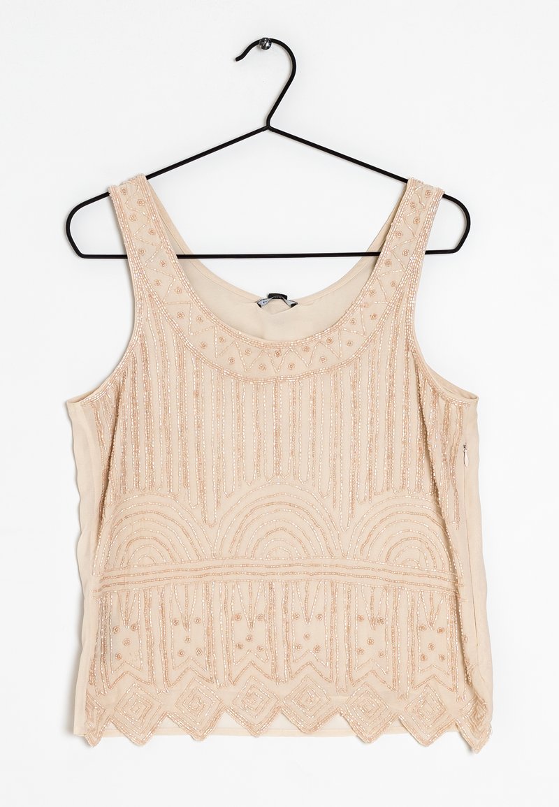 Beaded tan tank top with a round neckline, featuring decorative patterns and textured accents along the hem and bodice.
