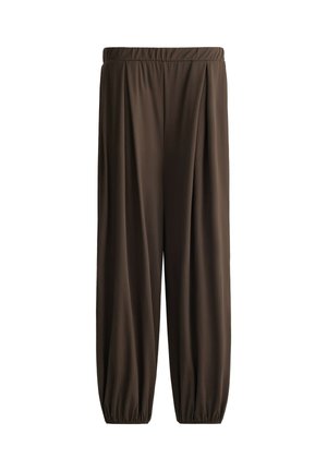 Pantalon ample marron foncé avec taille élastique et poignets élastiques froncés aux chevilles sur fond blanc.