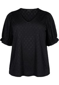 Blouse noire à manches courtes avec un décolleté en V, un tissu texturé avec des motifs découpés, et des manches légèrement bouffantes.