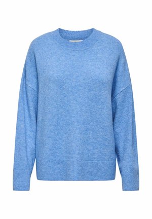 Ljusblå, oversized tröja med rund halsringning och design med sänkt axelsöm. Mjuk textur och ribbade muddar och fåll. Inga synliga mönster eller detaljer i metall.