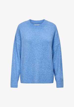 Šviesiai mėlynas, per didelis megztinis su apvalia iškirpte ir nuleistomis pečių linijomis. Minkšta tekstūra, su ribbingu rankogaliais ir apačia. Nėra matomų raštų ar apdailos elementų.