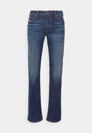 Dark blue denim jeans with a straight-leg design, featuring five pockets, subtle fading, and orange stitching accents.