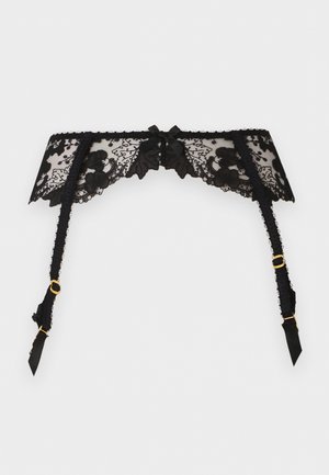 Čierny čipkový podväzkový pás s kvetinovými vzormi, malou stredovou mašľou a nastaviteľnými zlatými kovovými sponami na popruhoch.