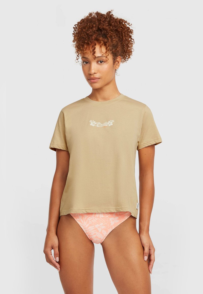 Beige cotton t-shirt with short sleeves and a rounded neckline, featuring a white floral graphic on the chest. Worn with pink patterned bikini bottoms.