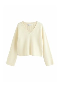 Cremefarvet, cropped sweater med ribbet tekstur, V-hals og lange ærmer. Har en afslappet pasform og et enkelt design.