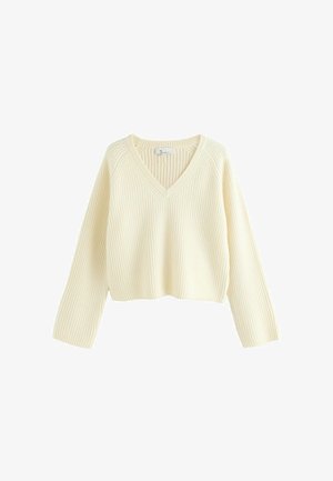 Cremfarbener, verkürzter Pullover mit gerippter Textur, V-Ausschnitt und langen Ärmeln. Verfügt über eine lockere Passform und ein einfaches Design.