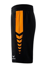 Pantaloni sportivi neri con una striscia verticale arancione e modelli a chevron sul lato, una vita elasticizzata e tasca con zip.