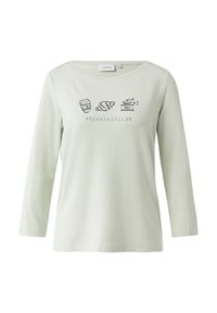 Długorękawowy, jasnozielony top z okrągłym dekoltem, zdobiony czarnymi nadrukami przedstawiającymi elementy śniadaniowe oraz napisem "BREAKFASTCLUB."