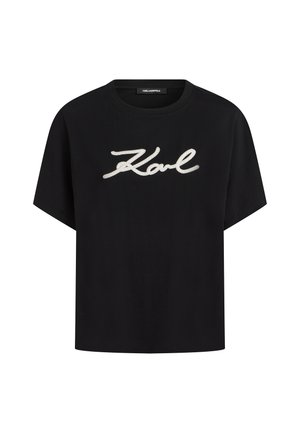 Μαύρο κοντομάνικο T-shirt με λευκή επιγραφή "Karl" στο στήθος και στρογγυλή λαιμόκοψη.