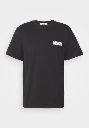 Mustan puuvillan t-paita, jossa on pyöreä kaula-aukko, lyhyet hihat ja valkoinen "MSGM" -logo vasemmassa rinnassa. Yksinkertainen, suora leikkaus.
