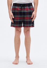 Κόκκινο, πράσινο και μαύρο καρό σορτς κατασκευασμένο από μαλακό ύφασμα. Διαθέτει ελαστική μέση με κορδόνι και άνετη εφαρμογή.