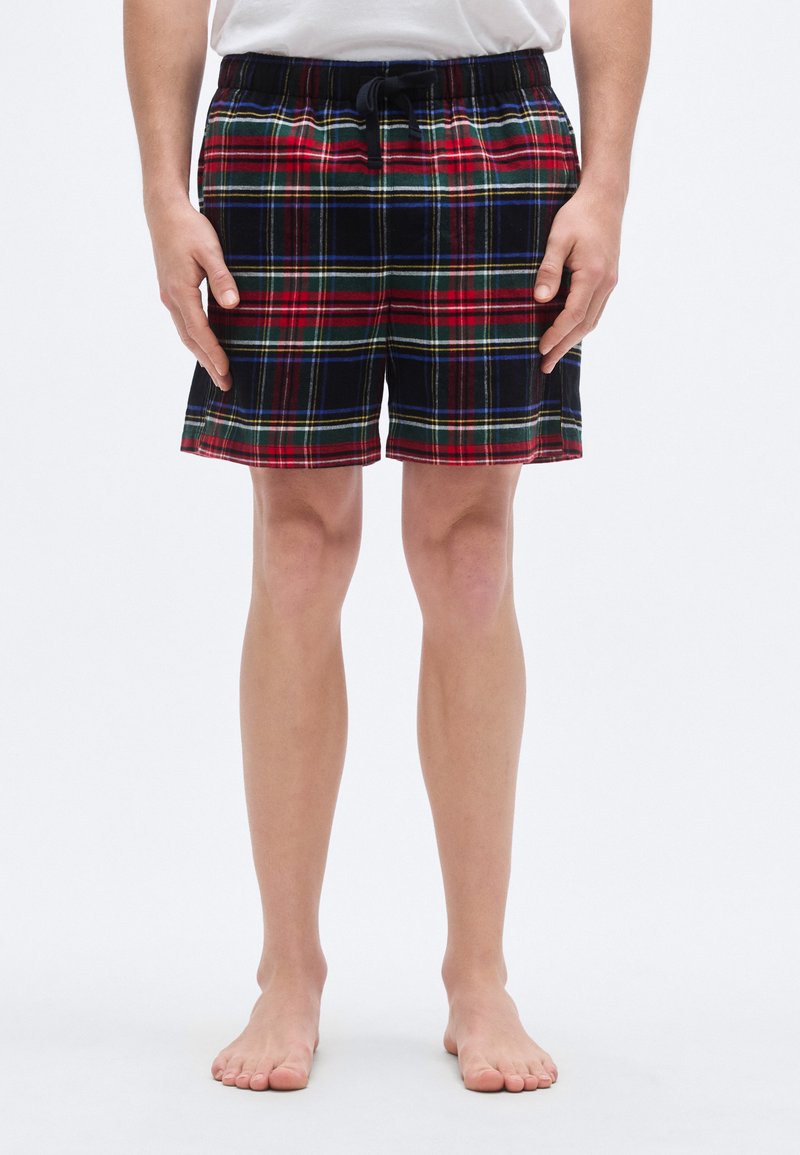 Κόκκινο, πράσινο και μαύρο καρό σορτς κατασκευασμένο από μαλακό ύφασμα. Διαθέτει ελαστική μέση με κορδόνι και άνετη εφαρμογή.