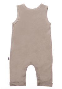 Beigefarbenes ärmelloses Jumpsuit aus weichem Stoff mit entspannter Passform, das Druckknopfverschlüsse an den Beinöffnungen und eine umgeschlagene Saumdetail bietet.