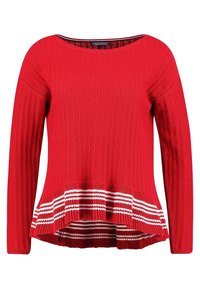 Red knitted sweater with a scoop neckline, long sleeves, and a flared bottom. Features white striped detailing at the hem.