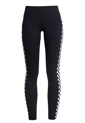 Black leggings featuring a side panel with a black and white checkered pattern. Made from stretchy fabric, offering a fitted cut and smooth texture.