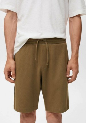 Olivgrüne Baumwollshorts mit einem elastischen Taillenbund, Kordelzugdetail und Seitentaschen, im lässigen Schnitt und mit glatter Textur.