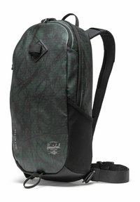 Sac à dos noir et vert avec un motif texturé, un design élégant, des bretelles réglables et une poche avant avec un clip triangulaire.