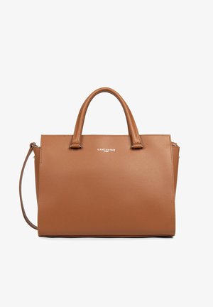 Brown leather tote bag with structured design, dual top handles, detachable shoulder strap, and silver logo on front. Smooth texture.