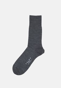 Grå strumpa tillverkad av ett slätt material, med en ribbad mudd, förstärkt häl och en logotyp vid vristen i vit text.