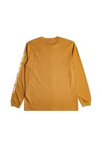 Long-sleeve shirt in mustard color, made of soft fabric. Features a crew neck and white text printed vertically on the left sleeve.