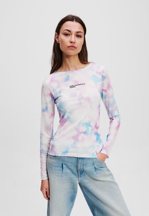 Long-sleeve top in ribbed fabric featuring an abstract blue, pink, and white pattern; small black logo on the left chest.