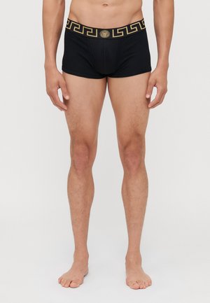Boxer brevi neri con un motivo a chiave greca dorata lungo l'elastico in vita, realizzati in un tessuto morbido e elastico per il massimo comfort.