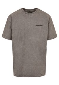 Gray oversized t-shirt made from cotton with a distressed finish. Features a round neckline and a small black logo on the chest.