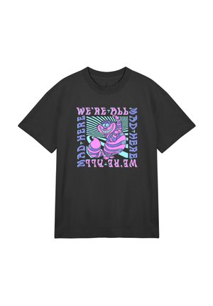Black cotton t-shirt featuring a colorful graphic print of a smiling striped cat with the text “WE'RE ALL MAD HERE” in bold, whimsical fonts.