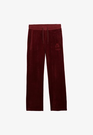 Pantalones de chándal de terciopelo burdeos para hombre con cintura elástica, cordón, bolsillos laterales y un sutil logo bordado en el muslo izquierdo.