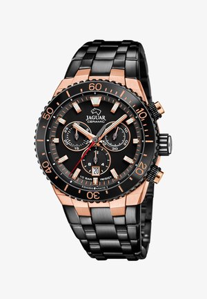 Melna keramikas pulksteņi ar rozā zelta akcentiem, hronogrāfa ciparnīcām, melnu rāmi un saites aproci. Iespējas datuma rādītājs un ūdensizturība.