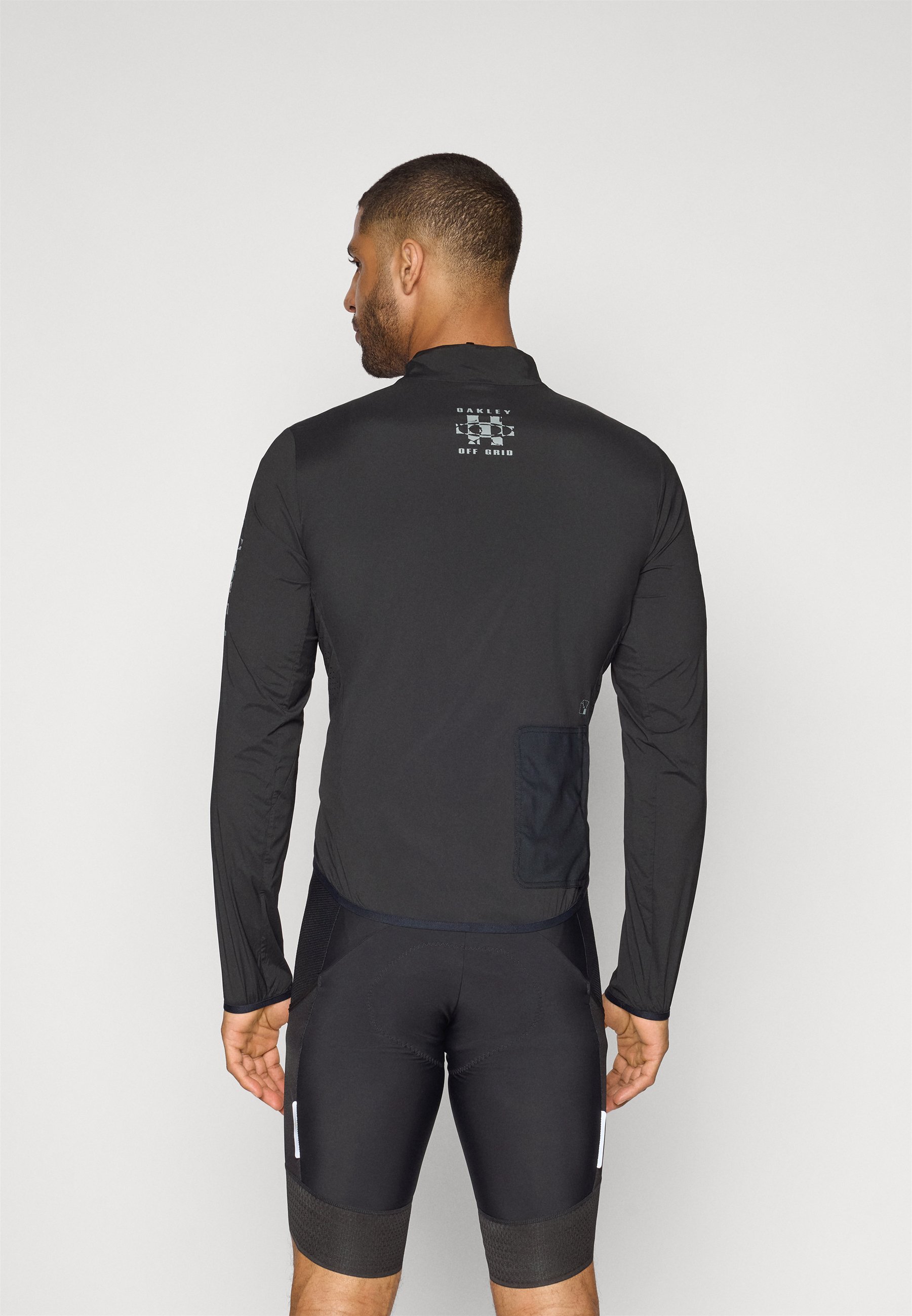Oakley OFF GRID JACKET - Cortaviento - blackout/negro - Zalando.es