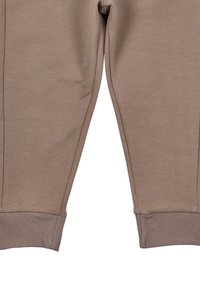 Bruine sweatpants met een zachte stof, taps toelopend ontwerp en geribde boorden. Geen zichtbare zakken of patronen. Geschikt voor casual wear.