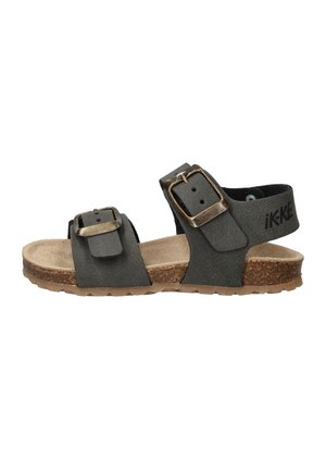 Zwarte leren sandalen met twee verstelbare banden, metalen gespen en een kurken zool. De binnenvoering is lichtbeige suede.