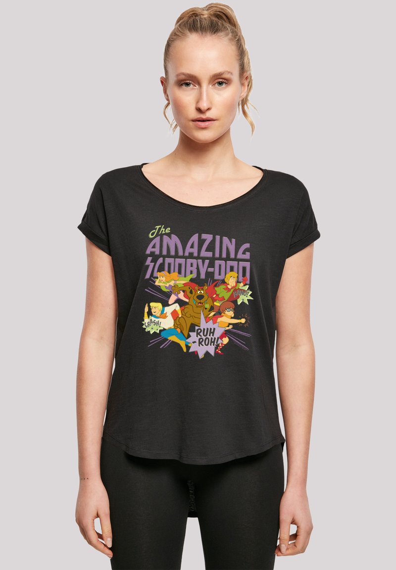 Black short-sleeve T-shirt featuring a colorful graphic design of characters from "Scooby-Doo." Material appears soft and lightweight.