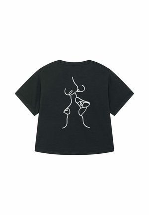 T-shirt in cotone nero con vestibilità morbida. Presenta un disegno astratto minimalista in linea bianca sul retro, che raffigura figure astratte. Maniche corte.