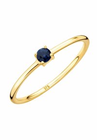Anello d'oro con un zaffiro blu rotondo e sfaccettato incastonato in un design a quattro artigli. Marcato '375' all'interno della fascia, a indicare la purezza dell'oro.