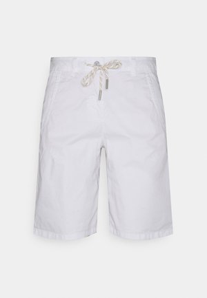Bílé bavlněné kraťasy s uvolněným střihem, mají stahovací pasek a dvě boční kapsy. Hladká textura, jednoduchý design.